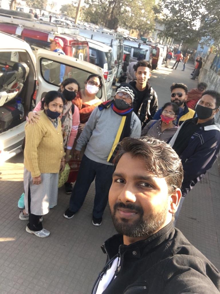 Group waiting at the vehicle stand for a Darjeeling transfer