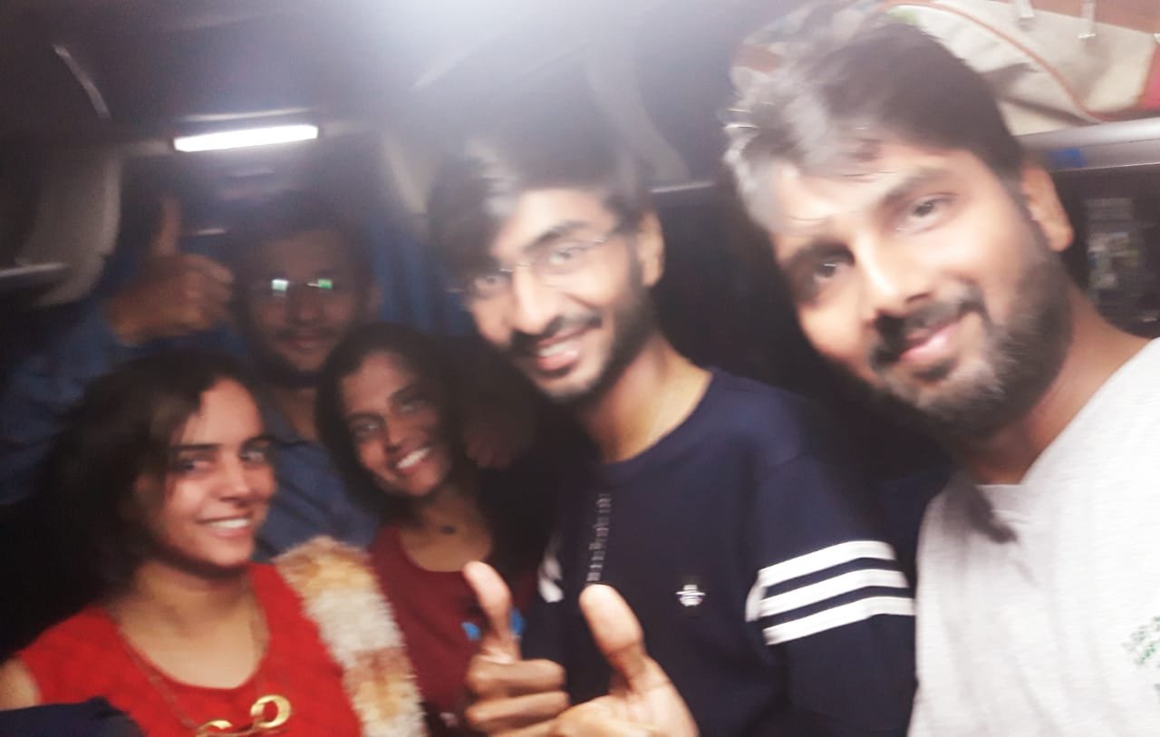 Friends sharing a night drive on the road to Darjeeling