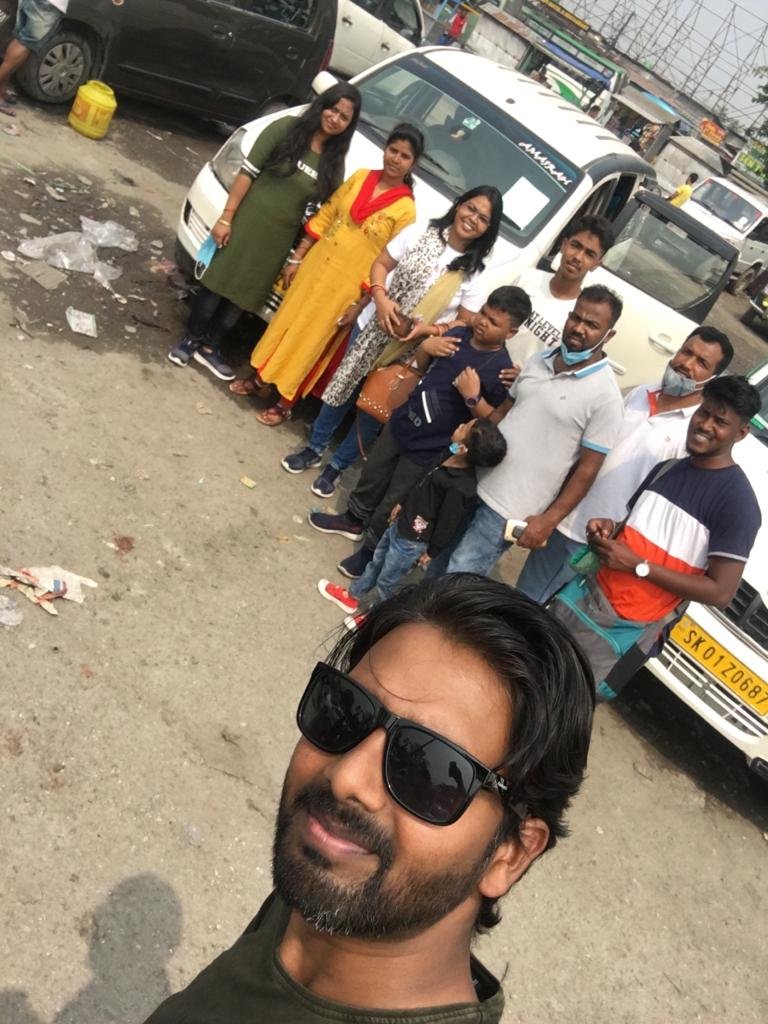 Group with their hired vans before a Mirik day trip