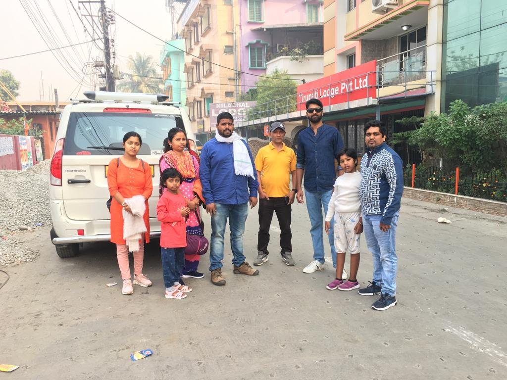 Family with their hired SUV outside our Siliguri office
